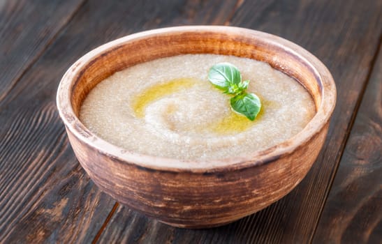 Bowl of Amaranth Porridge on wooden background