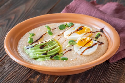 Amaranth Porridge bowl with eggs and avocado