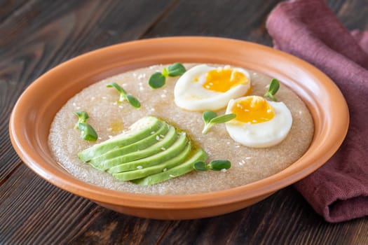 Amaranth Porridge bowl with eggs and avocado