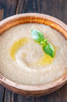Bowl of Amaranth Porridge on wooden background