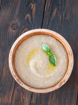 Bowl of Amaranth Porridge on wooden background