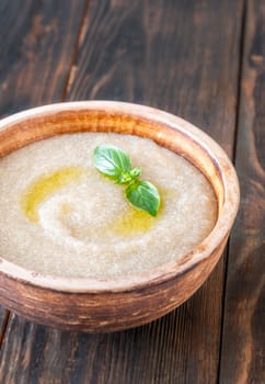 Bowl of Amaranth Porridge on wooden background