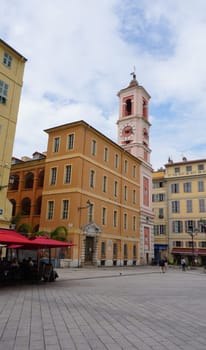Nice, France - September 22, 2024: Palais Rusca Palace and Tour de l'Horloge clock tower at Place du Palais de Justice Palace square in historic Vieux Vieille Ville old town of Nice
