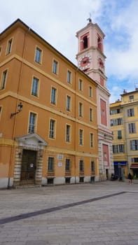 Nice, France - September 22, 2024: Palais Rusca Palace and Tour de l'Horloge clock tower at Place du Palais de Justice Palace square in historic Vieux Vieille Ville old town of Nice