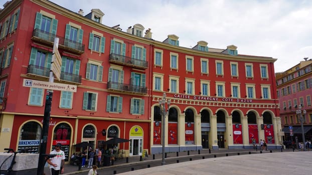 Nice, France - September 22, 2024: People going at Place Massena - people, transport and architecture in cloudy weather, city views of Nice, French Riviera, France