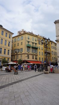 Nice, France - September 22, 2024: People going near beautiful architecture of Nice, south France