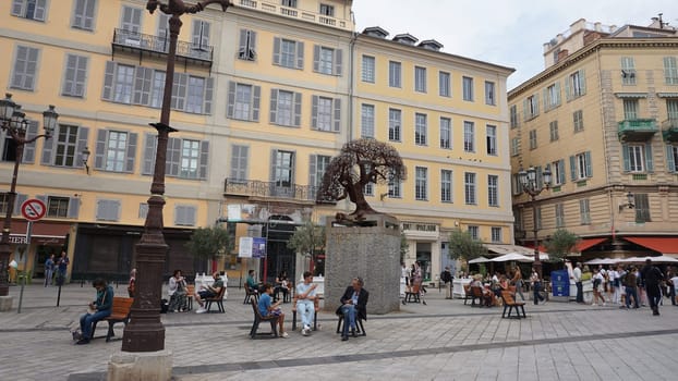 Nice, France - September 22, 2024: People going near beautiful architecture of Nice, south France