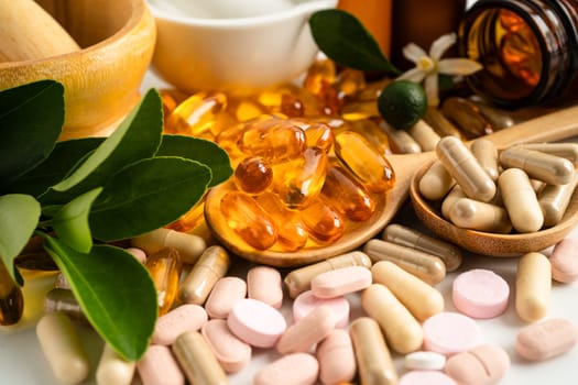 Alternative medicine herbal organic capsule with vitamin E omega 3 fish oil, mineral, drug with herbs leaf natural supplements for healthy good life.