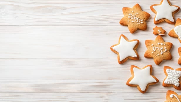 Christmas gingerbread star shaped cookies with white icing on white wooden background, copy space
