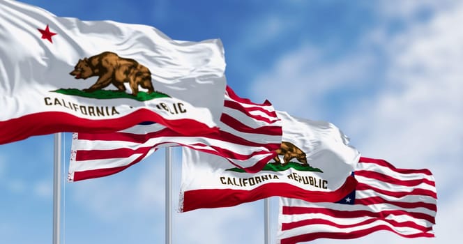 California state flags and the American flags waving in the wind, featuring a brown bear and the words “California Republic”. 3d illustration render. Fluttering fabric. Selective focus