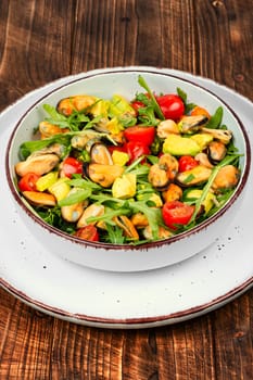 Seafood salad with vegetables and mussels.