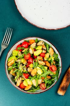 Seafood salad with vegetables and mussels.