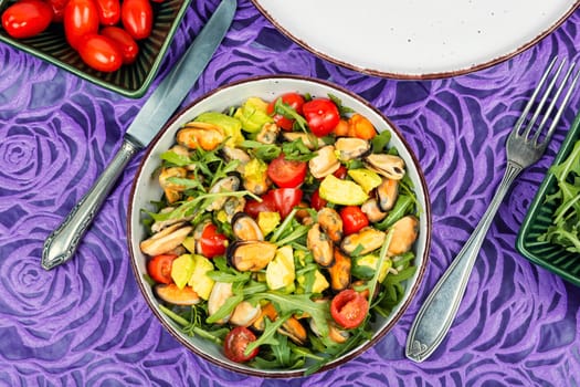 Seafood salad with vegetables and mussels.