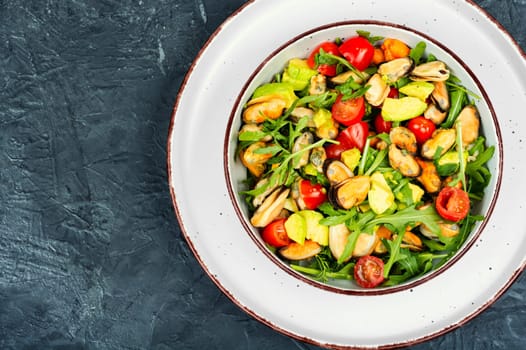 Seafood salad with vegetables and mussels.