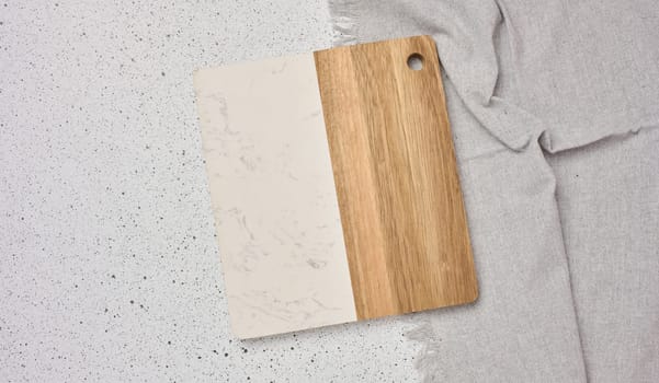 Empty wooden kitchen cutting board on a white background, top view