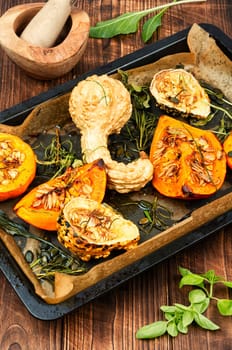 Delicious baked or butternut squash pumpkin with herbs.