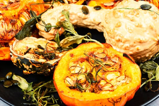 Delicious baked or butternut squash pumpkin with herbs.