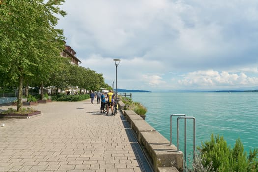 Ueberlingen, Germany – August 02, 2024: Lake promenade, Seepromenade with some tourists in Uberlingen on Lake Constance, Bodensee
