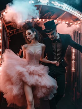 Handsome man in a hat and elegant woman in a dress in Inside the classic entrance archway . Halloween party carnival concept.