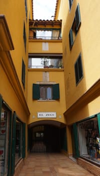 Lloret de mar, Spain - September 30, 2024: Facades of building and street in the city Lloret de mar on the Mediterranean coast.