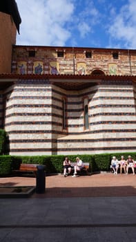 Lloret de mar, Spain - September 30, 2024: People resting near Parish Church of Sant Roma. Lloret de Mar, Spain, Costa Brava, province Girona at Catalonia.