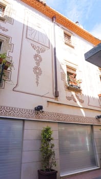 Lloret de mar, Spain - September 30, 2024: Facades of building and street in the city Lloret de mar on the Mediterranean coast.