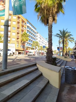 Lloret de mar, Spain - September 30, 2024: Facades of building and street in the city Lloret de mar on the Mediterranean coast.