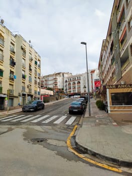 Lloret de mar, Spain - September 30, 2024: Facades of building and street in the city Lloret de mar on the Mediterranean coast.
