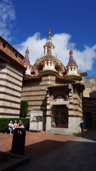 Lloret de mar, Spain - September 30, 2024: People resting near Parish Church of Sant Roma. Lloret de Mar, Spain, Costa Brava, province Girona at Catalonia.