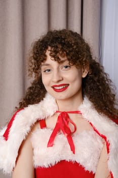 Close up portrait of beautiful woman with curly hair in Snow Maiden costume