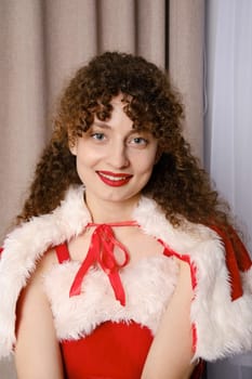 Close up portrait of beautiful woman with curly hair in Christmas costume