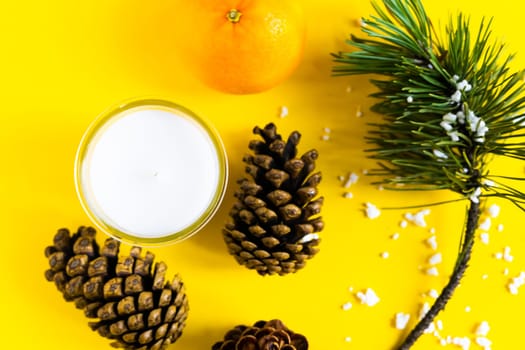 Christmas background with a fir tree branches and tangerines. Merry Christmas and Happy New Year