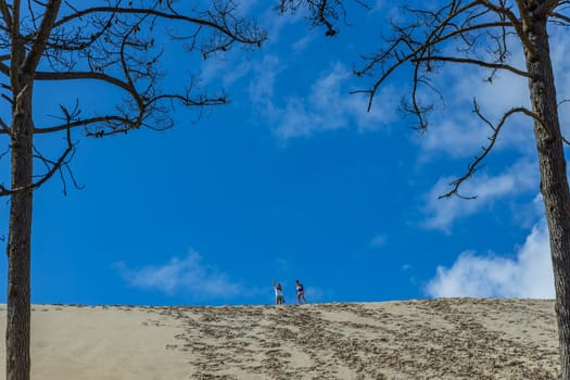 Dune of Pilat, France - August 14, 2024: kids on the Dune of Pilat, the tallest sand dune in Europe. La Teste-de-Buch, Arcachon Bay, Aquitaine, France