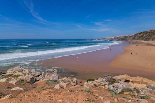 Sintra, Portugal: April 13, 2024: People at the beach of Foz do Lizandro, Ericeira, Portugal