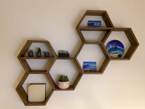 Hexagonal wooden house interior for house walls. Honeycomb shelves for interior home.