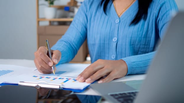 Businesswoman show paper documents to analyze business and manage corporate data, Business analytics with charts KPIs to improve organizational performance, Marketing and financial strategy.