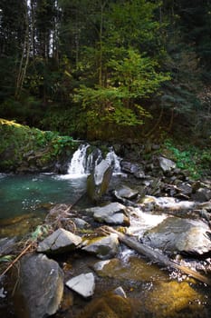 Very beautiful waterfall in autumn in the forest. Ukraine, Carpathians.