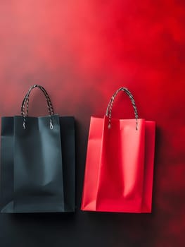Black and red shopping bags on a striking gradient background with ample copy space for text. Black Friday sale concept with empty place for text.