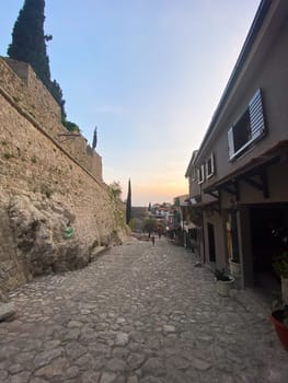 View of the street in Stari Bar Old Town of Bar in sunset, Montenegro.