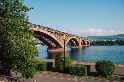 Communal bridge over the Yenisei River at beauty sunny summer day in Krasnoyarsk city.
