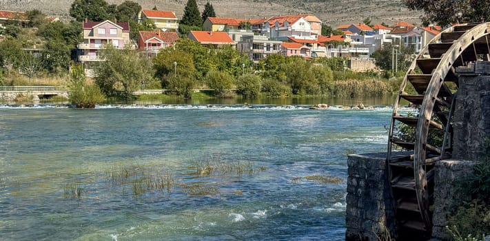 Cityscape from the Trebisnica River from an old water wheel. Trebinje, Bosnia and Herzegovina, 2 October 2024