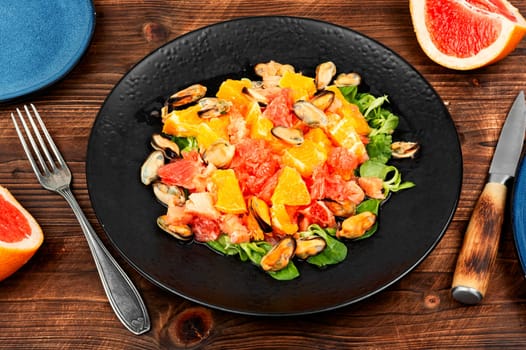 Seafood salad with fresh grapefruit, orange and mussels.
