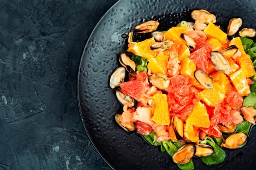Seafood salad with fresh grapefruit, orange and mussels.