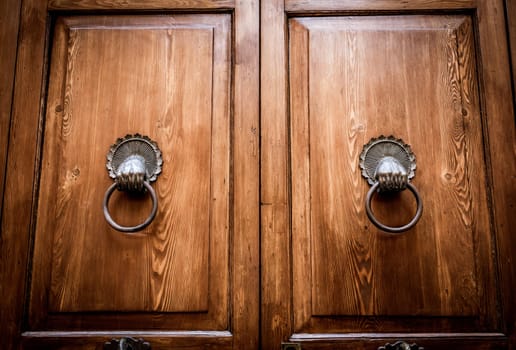 Mysterious old door entrance. Dark light. Abstract concept of secret, horror and magic.