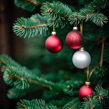 Sparkling ornament balls in vibrant red and white hang from a lush spruce tree branch. Soft warm lights twinkle enhancing festive spirit of Christmas. Happy New Year. Anamorphic  bokeh. Generative AI.