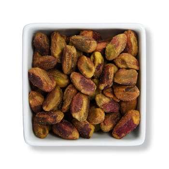 Pistachio nuts in white container with clipping path to remove shadow