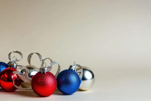 A collection of red blue and silver ornaments sits elegantly on a light surface showcasing festive colors for the holiday season.