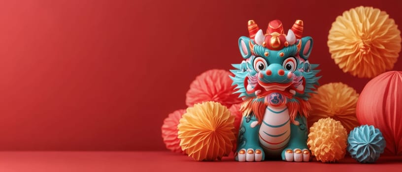 A vibrant dragon sculpture stands against a red backdrop surrounded by colorful pom poms celebrating a festive occasion with lively decor.