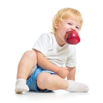 kid holding apple in mouth