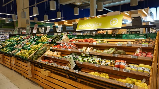 Palafrugell, Spain - September 9, 2024: Retail shelves and display cases in a hypermarket Esclat trademark is a big supermarket at Palafrugell, Spain